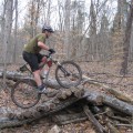 Grant riding log rollover at Hastie Park trails